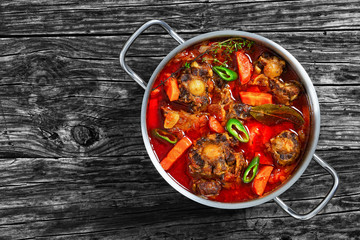 oxtail stew with vegetables, herbs, red wine