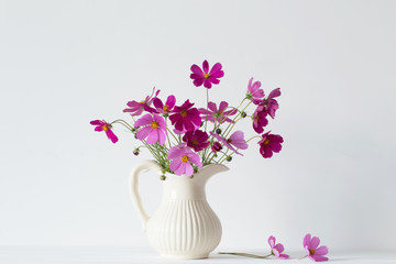 flowers in a vase on white background