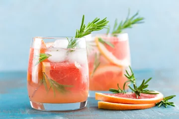 Foto op Canvas Grapefruit and rosemary gin cocktail, refreshing drink with ice © Sea Wave