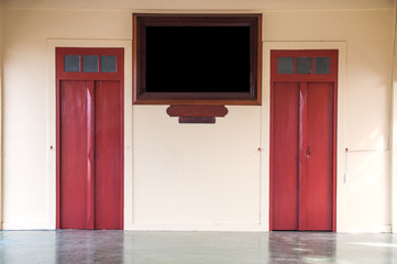 Fototapeta na wymiar Double vintage doors with black board in Thailand.