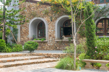 Vintage windows house with green plants, Thailand.