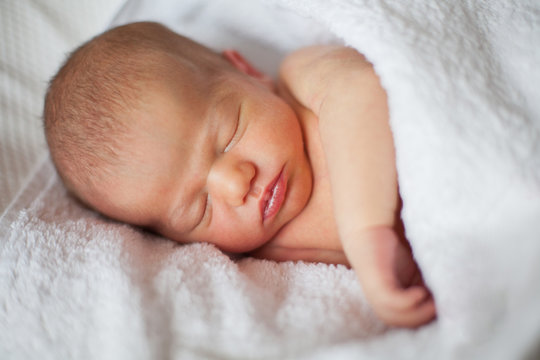 Portrait of a sleeping newborn girl