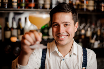 smiling close up barman with coctail
