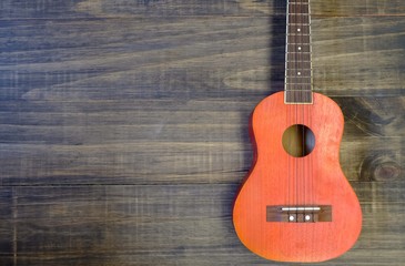 Fototapeta premium the guitar with wood background