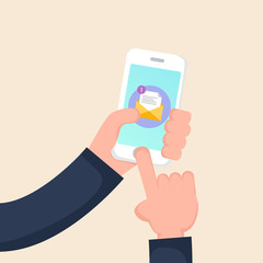 Hand holding smartphone with new message on screen. Chat, tweet, instant messaging, sms, mobile messenger concepts for web sites, web banners, printed materials.