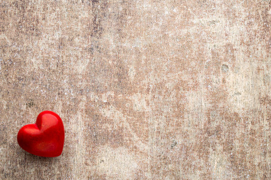 Red hearts on the wooden background.