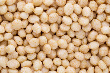 Corn flakes rings on the background.