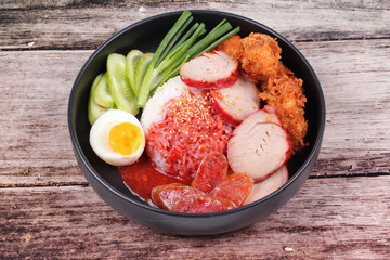 Jasmine rice with meat and boiled egg topped red sweet sauce .