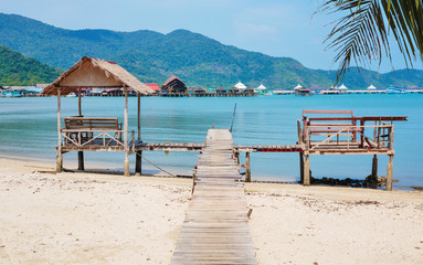 Wooden jetty on exotic beach Koh Chang island, Thailand