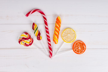 Candy cane and colorful bright different lollipops as orange and lemon