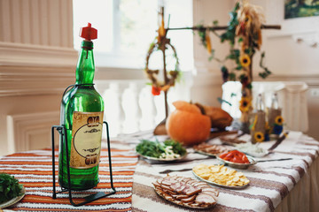 wedding buffet table with slicing meat and bottle of alcohol