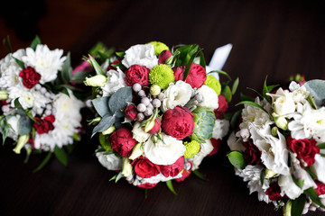 three beautiful wedding bouquets of delicate flowers