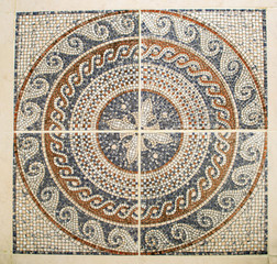 Fototapeta na wymiar Detail of the Arab mosaic floor of a geometrical form