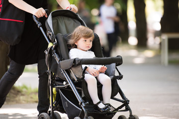 baby girl sitting in the pram