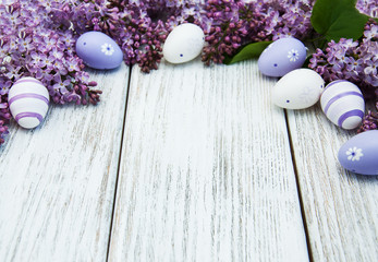 Fototapeta na wymiar easter eggs and fresh lilac flowers