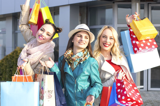 Happy Young Women with Shopping Bags