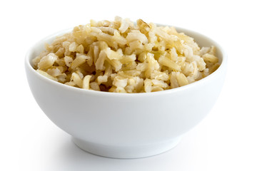 Bowl of cooked long grain brown rice isolated on white.