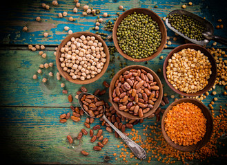 Raw legume on old rustic wooden table.