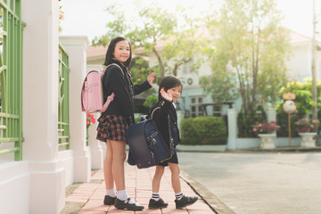 student going to school and waving goodbye