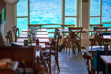 Summer empty openair cafe with beautiful view to the sea in popular area in Mykonos Little Venice