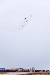 Air show in the sky above the Krasnodar airport flight school. Airshow in honor of Defender of the...