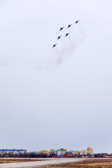 Air show in the sky above the Krasnodar airport flight school. Airshow in honor of Defender of the...
