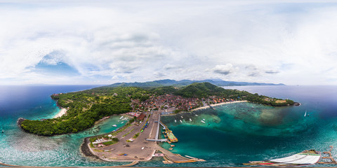 Spherical, 360 degrees, seamless aerial panorama of the tropical lagoon and marine port in the town of Padang Bai, Bali, Indonesia