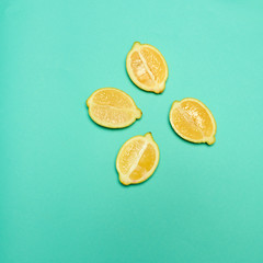 Lemons on green background
