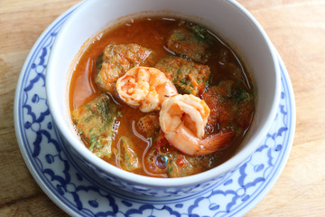 Spicy sour soup with deep fried acacia omelette