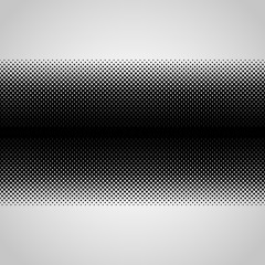 Halftone abstract black dots design element isolated on a white background.