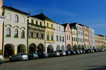 Naklejka premium Main Smetana Square in Litomysl, Pardubice Region, Czech Republic. Elongated street with baroque, classical and empire style facades of houses and originally preserved arcades.