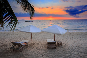 Sunset over Madagascar Nosy be beach with sunlounger - obrazy, fototapety, plakaty