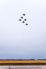Air show in the sky above the Krasnodar airport flight school. Airshow in honor of Defender of the...