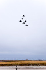 Air show in the sky above the Krasnodar airport flight school. Airshow in honor of Defender of the...