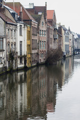 View of canals and  streets of Gent town, Belgium in rainy day in winter