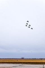 Air show in the sky above the Krasnodar airport flight school. Airshow in honor of Defender of the...