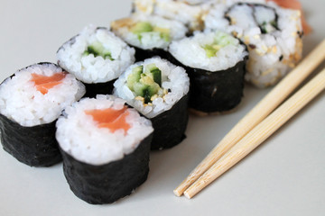 Set of sushi roll. Different types of sushes with chopstiks.