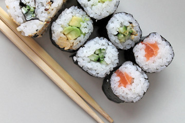 Set of sushi roll. Different types of sushes with chopstiks.