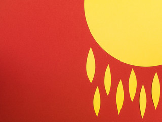 Illustration of The Sun With Flames or Tears Against a Red Background