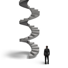 Concrete spiral staircase with man looking up