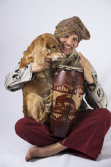 White man with a drum and a dog