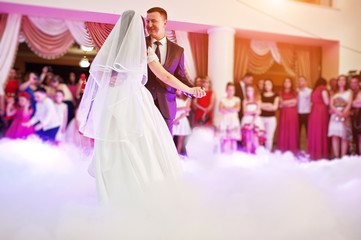 Awesome first wedding dance with smoke and rose purple lights.