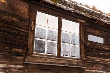A beautiful window of an old wooden scandinavian house