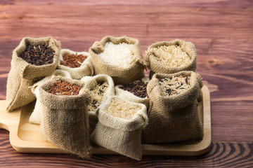 Jasmine rice, Brown rice, Red rice, Mixed rice and Riceberry rice in small hemp sacks.