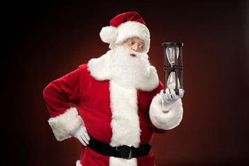 Santa Claus holding hourglass