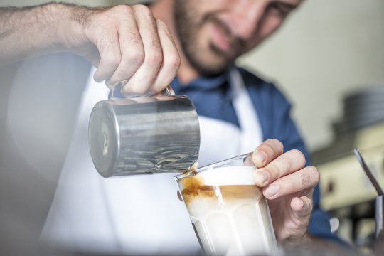 Barista preparing Latte Macchiato