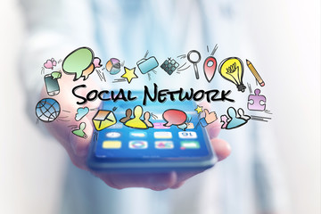 Concept of man holding smartphone with social network title and multimedia icons flying around