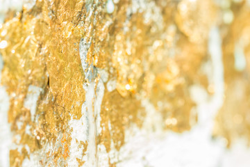 Abstract blurred texture of gold leaf.
