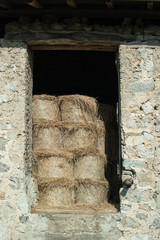 bales of hay in a rural house