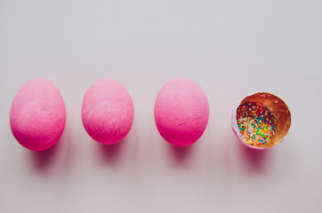 colorful pink easter eggs with confectionery sprinkling